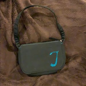 Black purse with the letter T